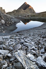 Frosty stones at lake Asti beneath the Taillante